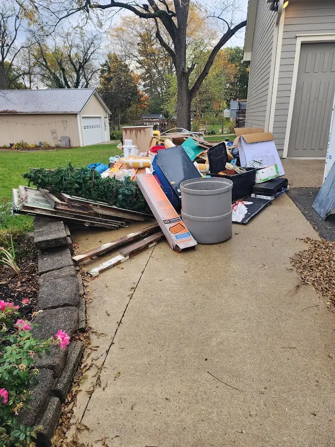 Dumpster being loaded with debris for 3 Yard Dumpster Rental in Detroit